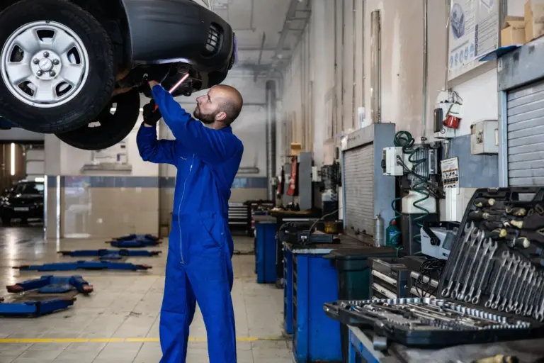 Technician working to remove AdBlue contamination from a car