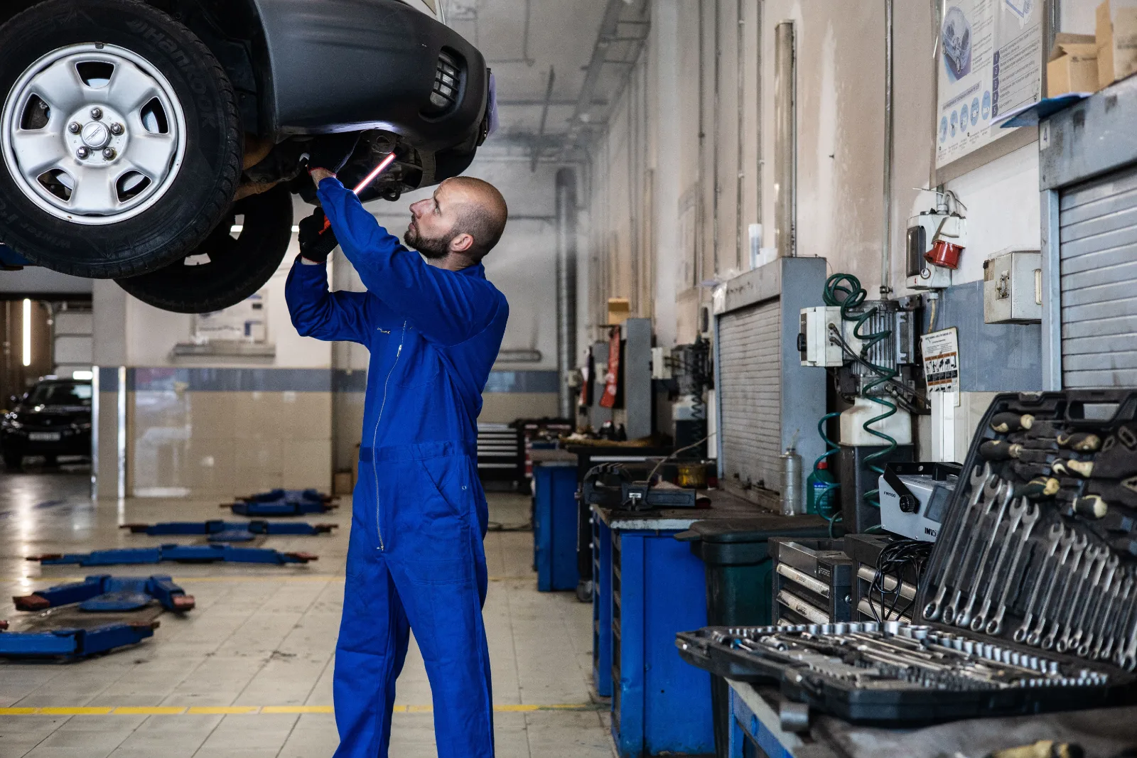 Technician working to remove AdBlue contamination from a car