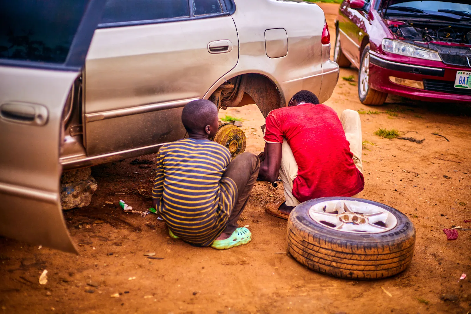 Mobile technician draining contaminated fuel from a diesel car