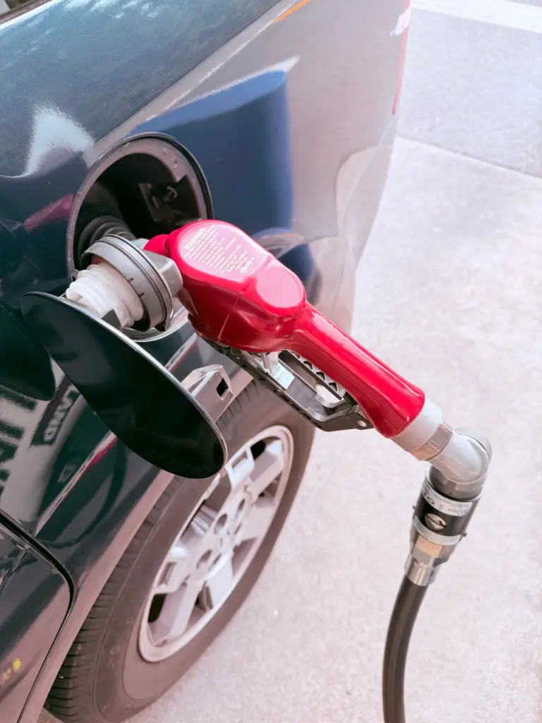 Petrol pump nozzle on a forecourt - the moment of an unleaded in diesel misfuelling mistake