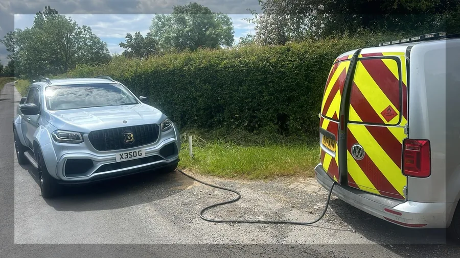 Fuel-DoctorUK technician draining contaminated fuel from a vehicle roadside